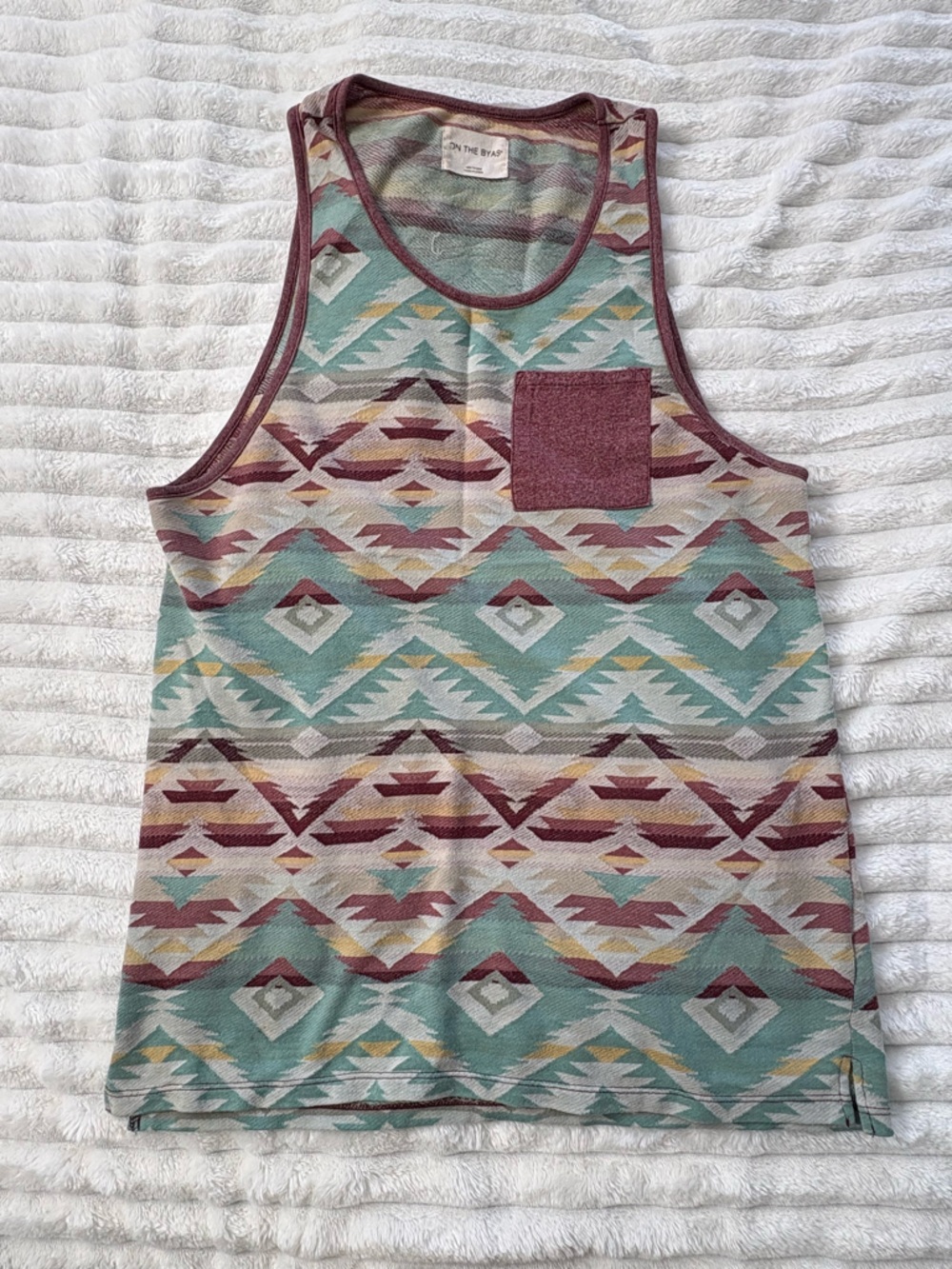 on the byas Teal and Maroon Aztec Tank